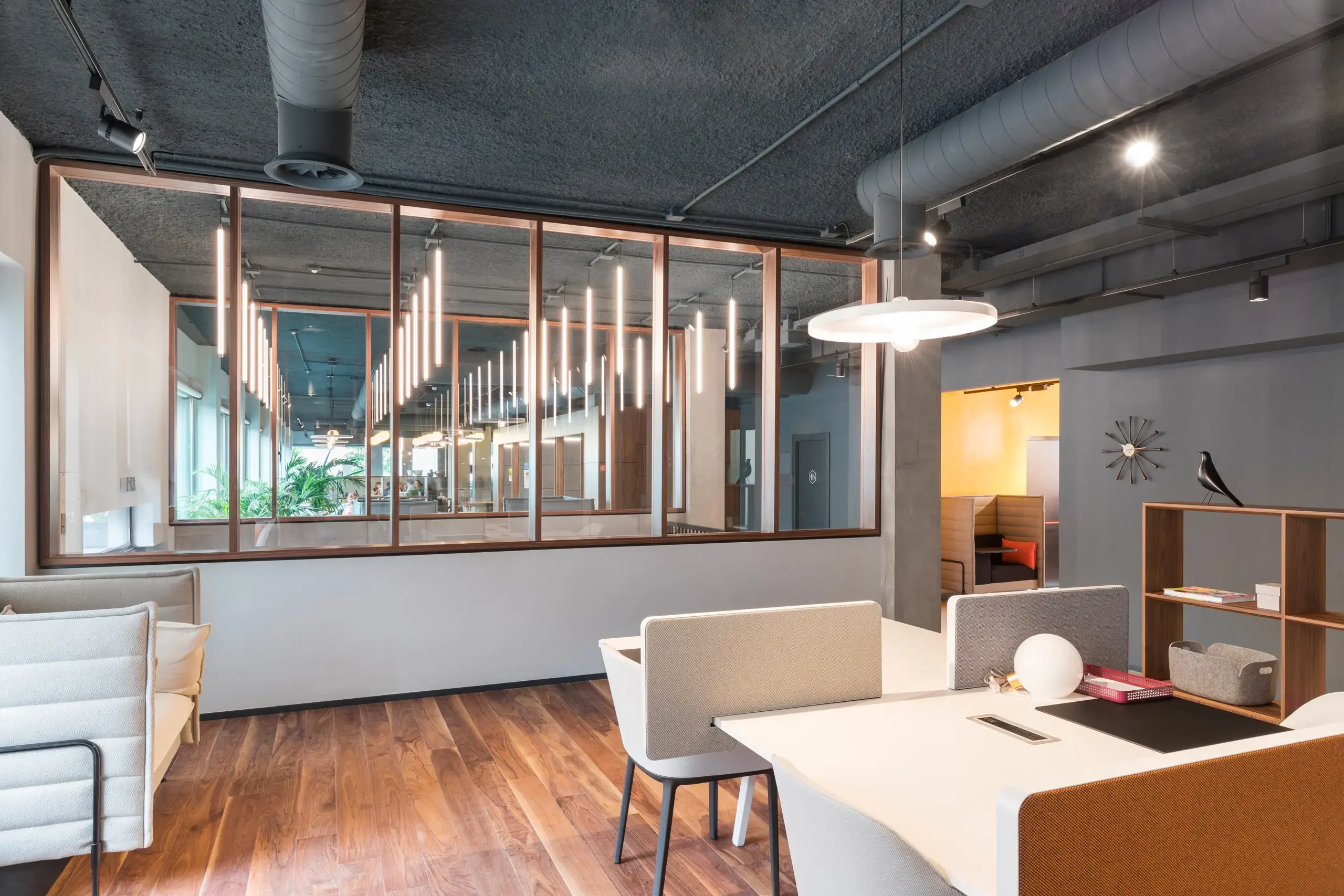 Workspace with glass partition and pendant lights