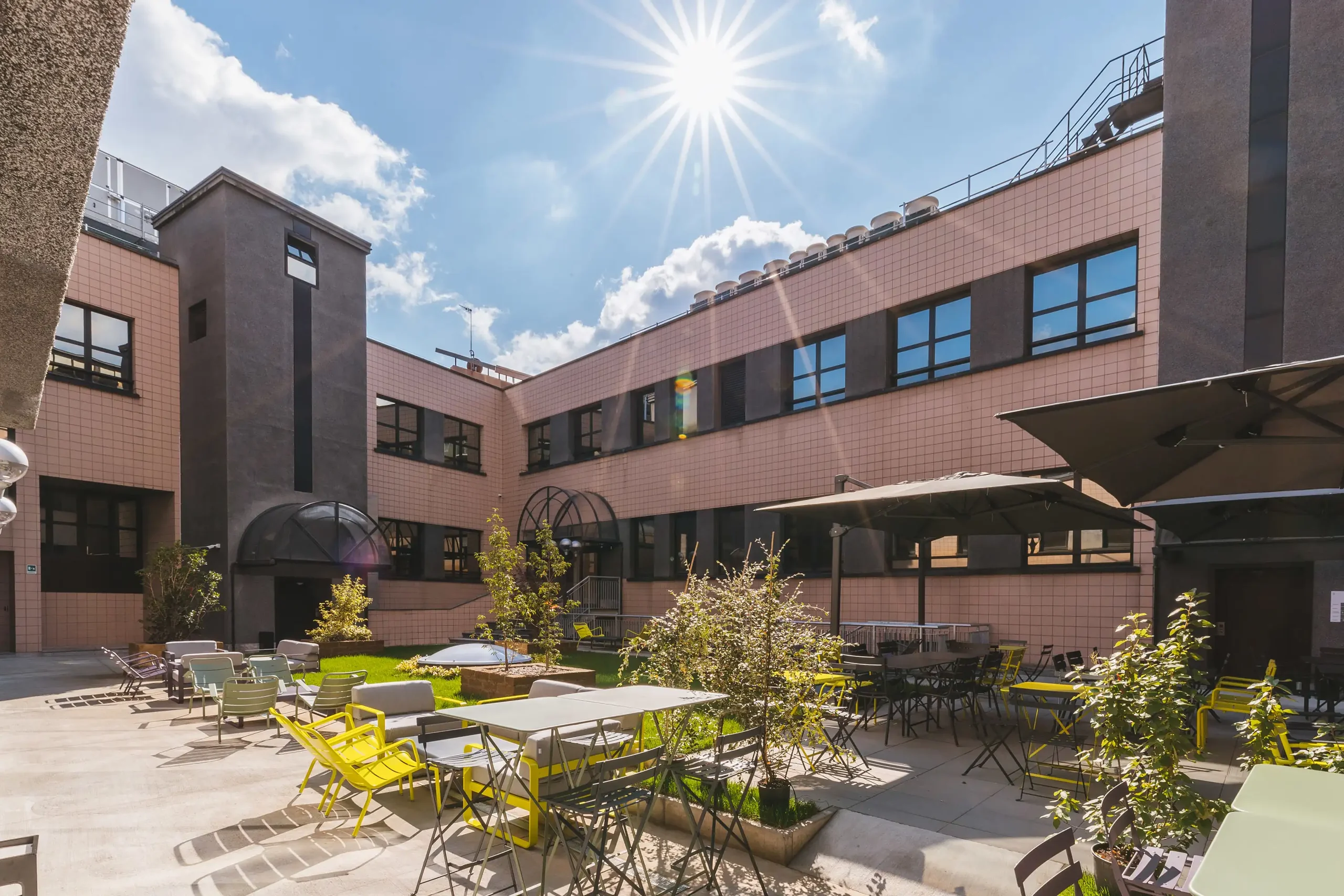 Inner courtyard with outdoor tables and planting