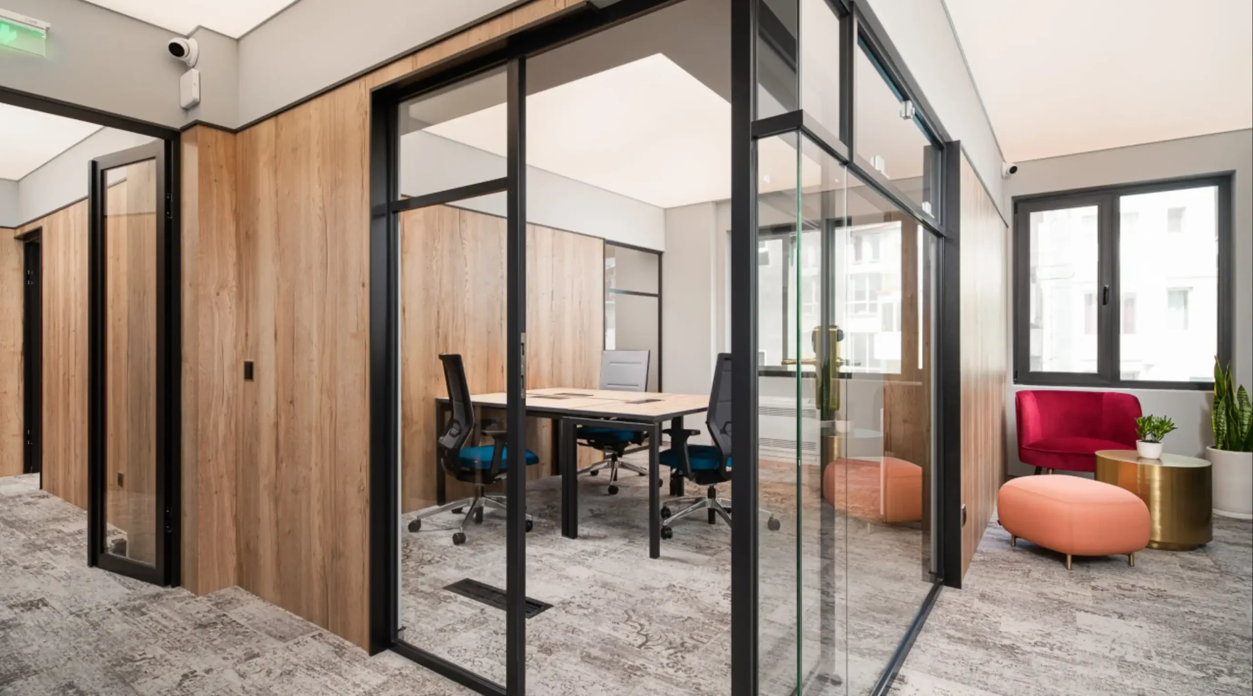 Glazed private office with wood panelling