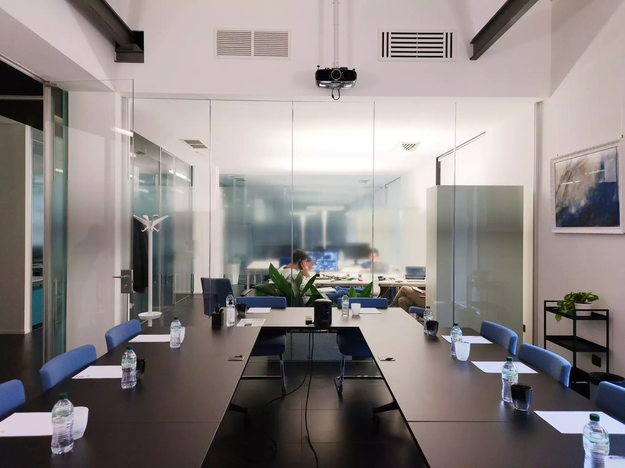 Meeting room with a projector and glass walls