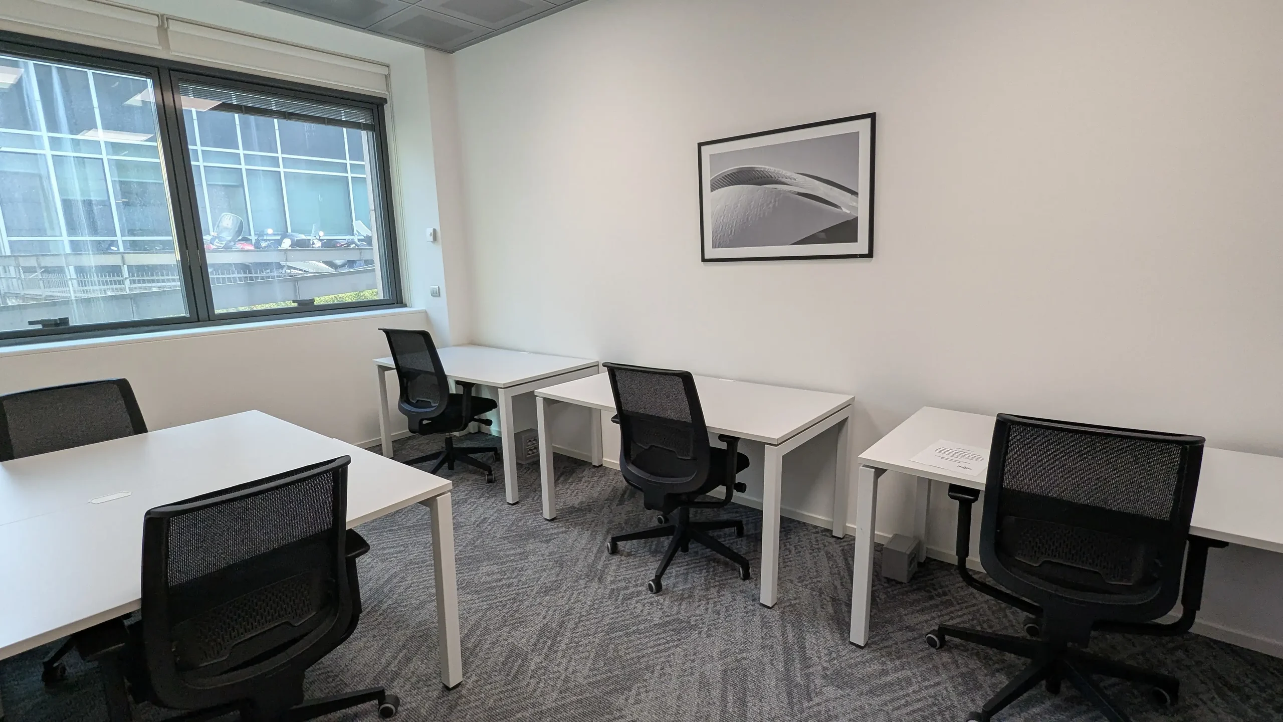 Private office with five desks and a window