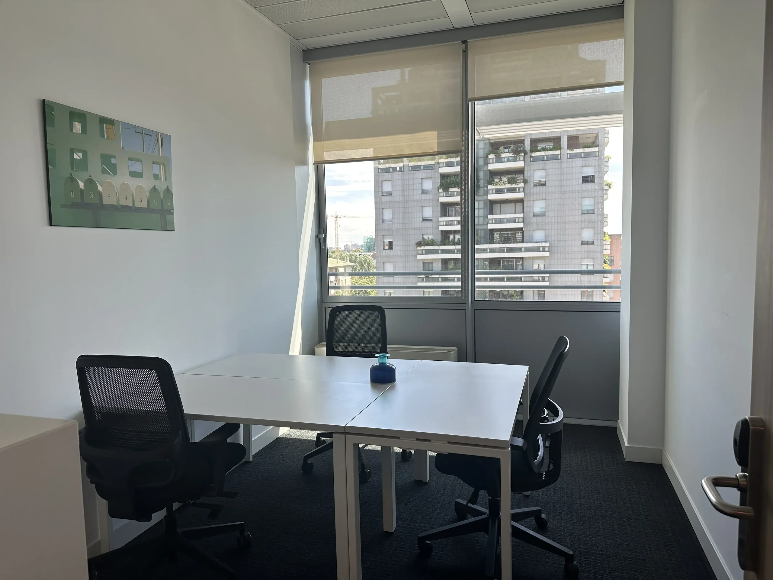 Private office with a window onto the city