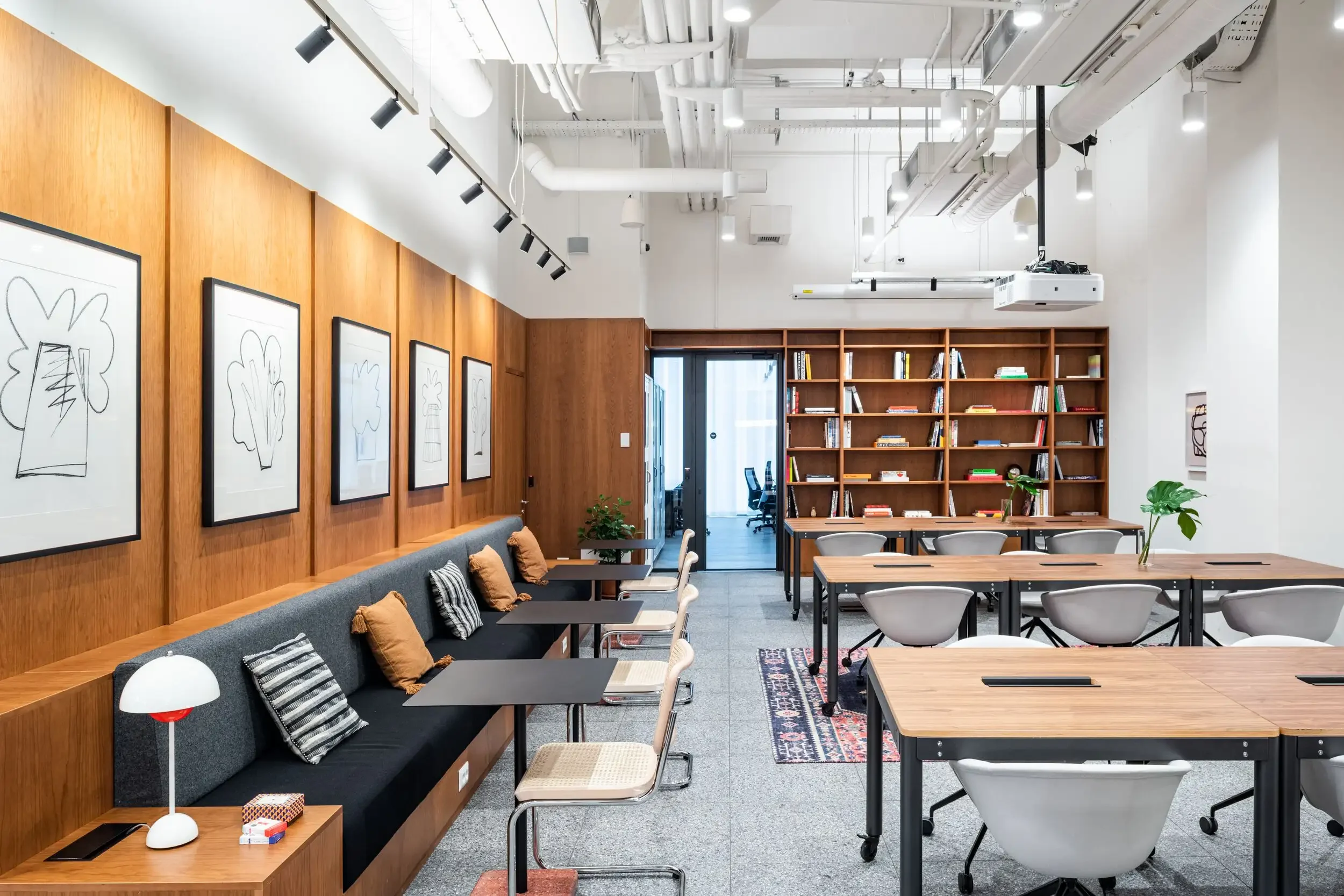 Coworking area with wood panelling and bookshelves