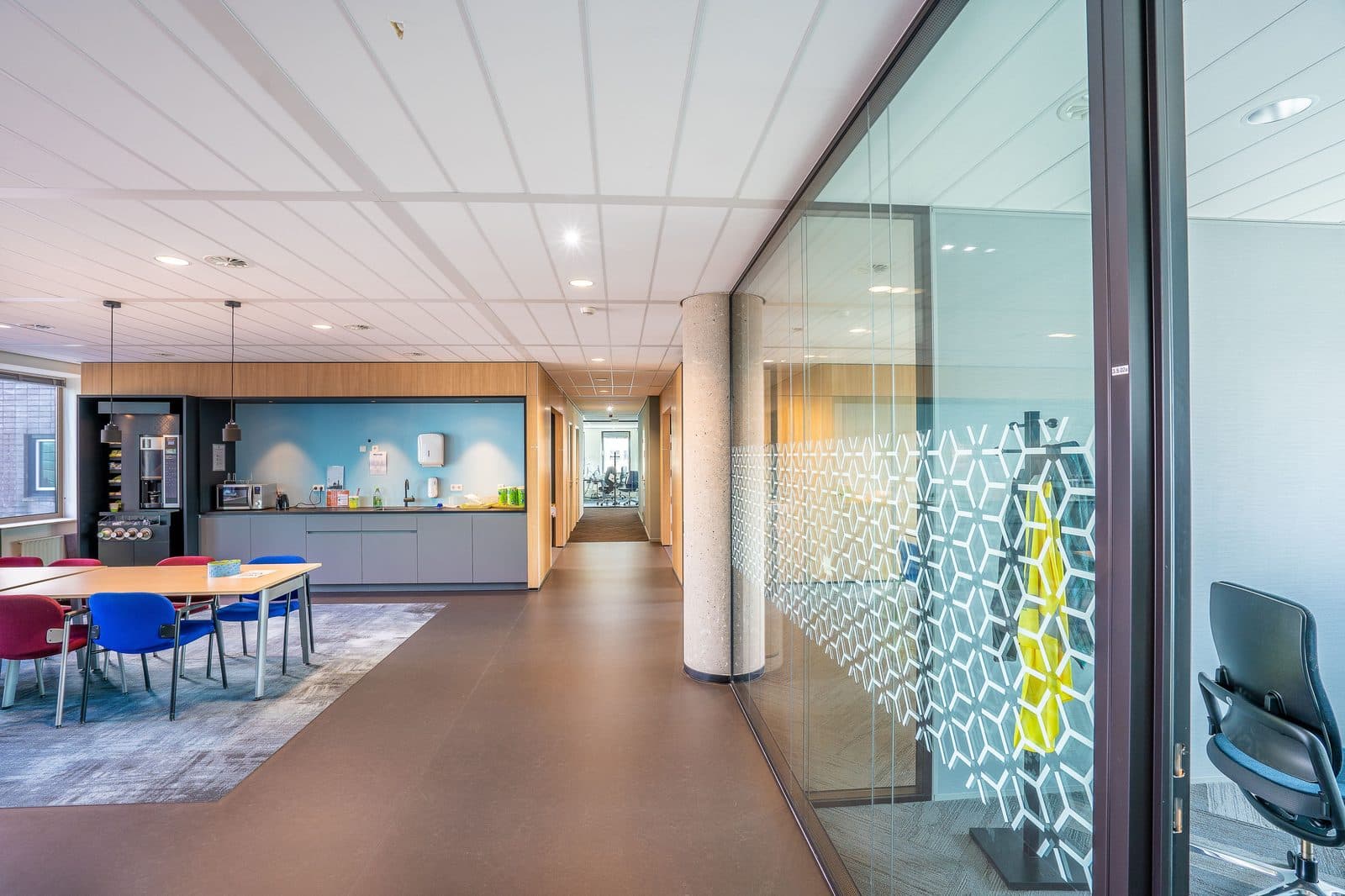 Glazed partition corridor inside a serviced office floor